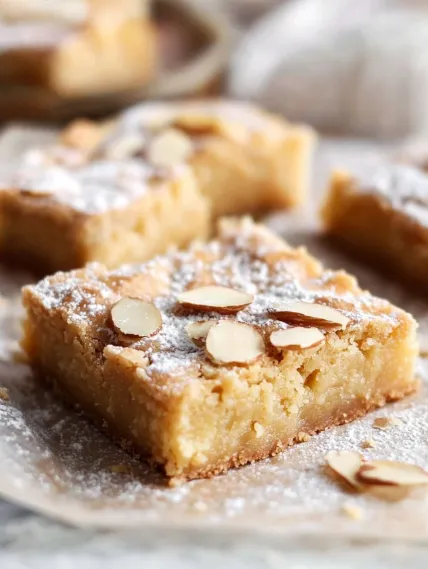 A close up of a dessert with almonds.