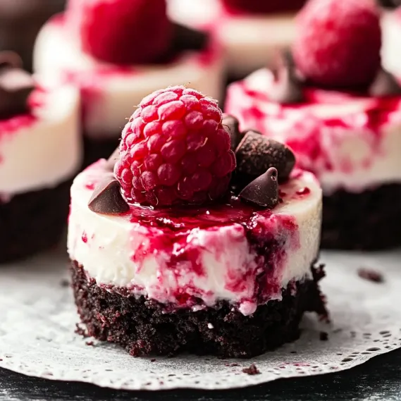 A rich chocolate base topped with raspberries.