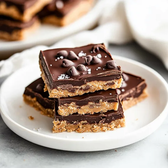 A dessert plate featuring chocolate-covered bars.