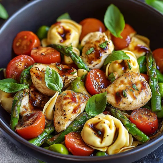 A bright bowl showcasing veggies, chicken, and pasta.