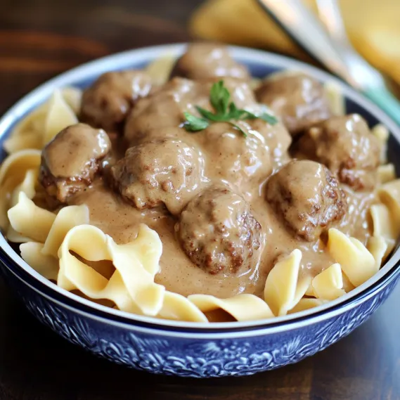 Plate of noodles served with creamy meatballs.