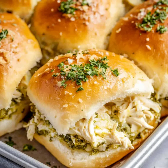 A tray of baked bread with meat and vegetables.