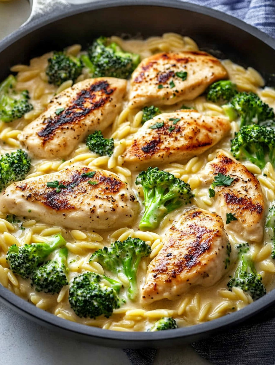 A delicious Mediterranean Creamy Chicken & Broccoli Orzo Skillet is ready to be served.