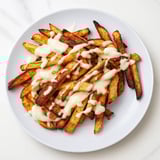 A dish of cheese-covered fries.