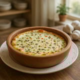 A bowl of delicious garlic sauce on a table.