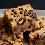 A close view of a square-shaped banana bar with chocolate chips.