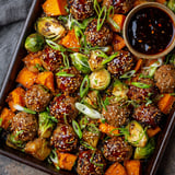Korean BBQ meatballs with roasted vegetables on a pan.
