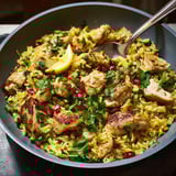 A bowl of fluffy chicken pilaf inspired by Persian cuisine.